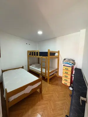 a bedroom with two bunk beds in a room at Casita de Playa 2026 in Supe