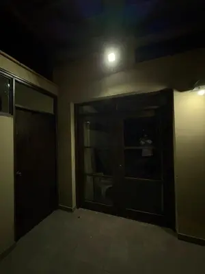 a dark room with a door and a window at Casa de campo Rosenthal - Cieneguilla in Panquilma