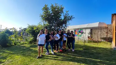 a group of people standing in the grass at Las Delicias in Huacho
