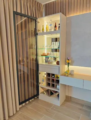 a closet with a glass door in a room at Apartamento amoblado in Lima