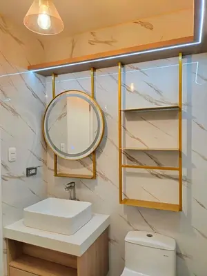 a bathroom with a sink and a mirror at Apartamento amoblado in Lima