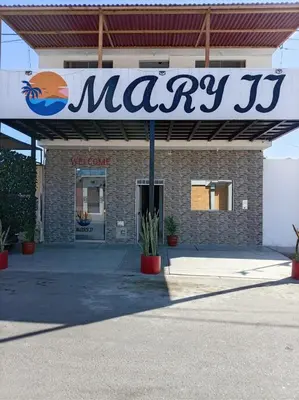 a may sign in front of a store at Mary 2 in Paracas
