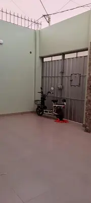 a motorcycle parked inside of a garage at Casa del Olivar Pisco in Pisco