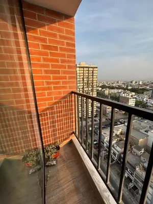 a balcony of a building with a view of a city at Modern apartment in Lima Surquillo in Lima