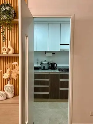 a kitchen with blue cabinets and a counter top at seipoz in Lima