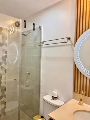 a bathroom with a shower and a toilet and a sink at seipoz in Lima