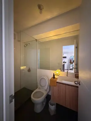 a bathroom with a toilet and a sink and a shower at Cozy apartment, downtown area, fully equipped in Lima
