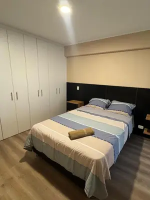 a bedroom with a large bed and white cabinets at Confortable y moderno apartamento en Lima, cerca al centro de Lima, MIraflores y San IsidroN ISIDRO in Lima