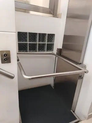 a stairwell with metal handrails in a room at Departamento Surquillo INEN in Lima