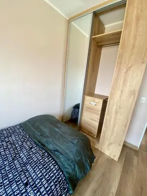 a bedroom with a bed and a large mirror at Large Apartment - Santa Beatriz 3 Bedrooms in Lima