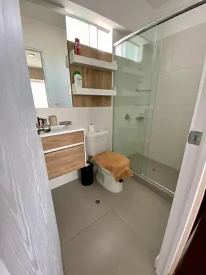 a bathroom with a toilet and a glass shower at Large Apartment - Santa Beatriz 3 Bedrooms in Lima