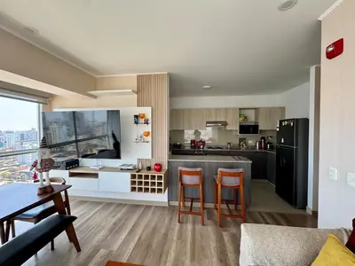 a kitchen with a table and chairs in a room at Large Apartment - Santa Beatriz 3 Bedrooms in Lima