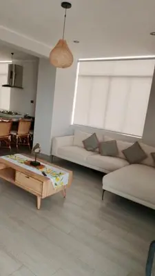 a living room with a couch and a coffee table at Punta Caleta Punta Hermosa in Punta Hermosa