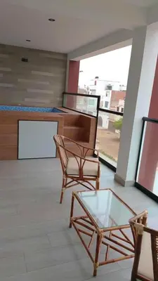 a room with two chairs and a table and a counter at Punta Caleta Punta Hermosa in Punta Hermosa