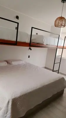 a bedroom with two bunk beds in a room at Punta Caleta Punta Hermosa in Punta Hermosa