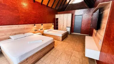 a bedroom with two beds in a room at Club InkaVida - Pachacamac in Pachacamac