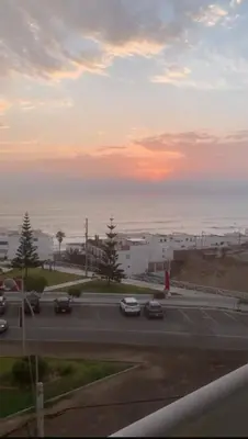 a parking lot with cars in a parking lot at Apartment facing Mirador Analí in Punta Hermosa
