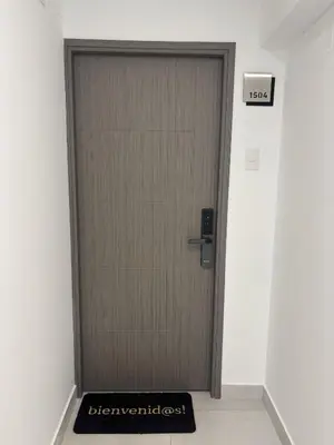 a door in a hallway with a sign on it at 2BR Apartment with Pool near Larcomar in Lima