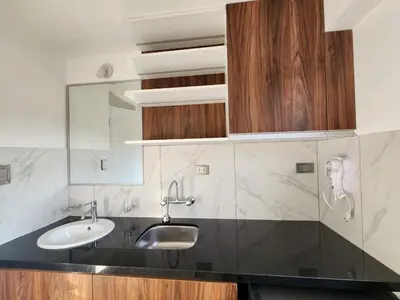 a bathroom with a sink and a mirror at Lama Vista Living 302 in Cusco