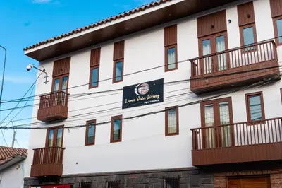 a building with balconies and a sign on it at Lama Vista Living 302 in Cusco