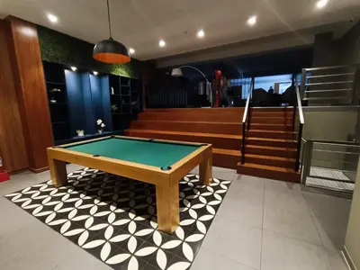 a pool table in the middle of a room at Barranco Bohemio, Modern and Bright Apartment in Lima