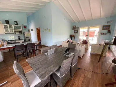 a large dining room with a table and chairs at Hermosa Casa de Campo en Azpitia in Santa Cruz de Flores