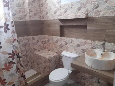 a bathroom with a toilet and a sink at Ocean Glips II in Punta Negra