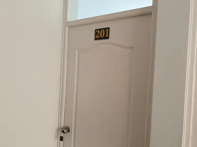 a door with a sign on top of it at Huacachina Boutique Hotel in Ica