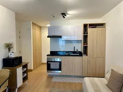 a kitchen with a sink and a stove at Mini Patria - Cozy apartment in Barranco in Lima