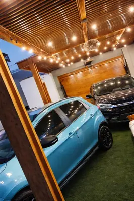 a small blue car parked in a garage at Casa Matta in Sunampe