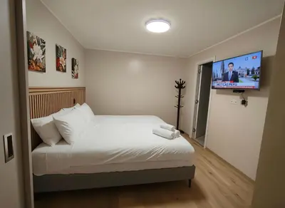 a bedroom with a bed and a flat screen tv at Costanera Tourist Free Parking 3B 708 in Lima