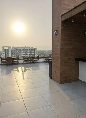 a balcony with tables and benches on a building at E SuiteCost FreeParking San Miguel 1B 708 in Lima