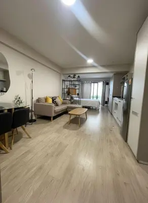 a living room with a couch and a table at E Free Parking Patio Privado Barranco 1B 109 in Lima