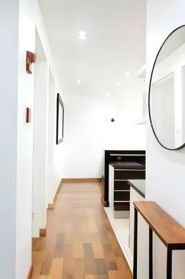 a hallway with white walls and a mirror on the wall at E Suite Tourist free Parking Miraflores 1B 503 in Lima