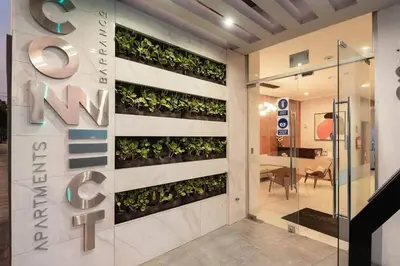 a vertical garden on the wall of a building at Peruvian Apartments Barranco 1710 in Lima