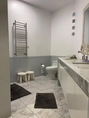 a bathroom with a toilet and a sink at Huaca Pucllana Design Apartment between Miraflores and San Isidro in Lima