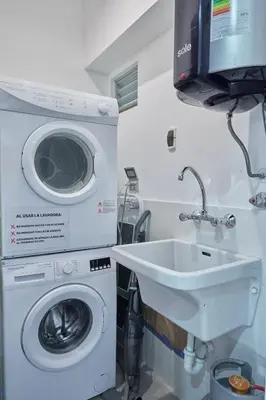 a washing machine and a sink in a bathroom at Barranco Bright apartment with Balcony in Lima