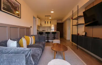 a living room with a couch and a table at Marvelous 2BR with Balcony in Miraflores in Lima