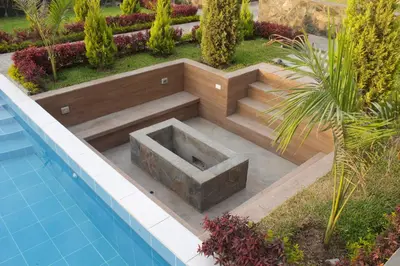a sunken seating area next to a swimming pool at Casa de Campo Pachacamac in Pachacamac