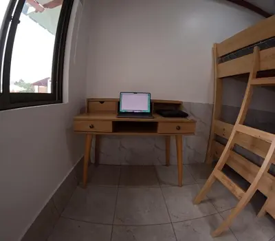 a laptop computer sitting on a desk in a room at Casa de Campo Pachacamac in Pachacamac