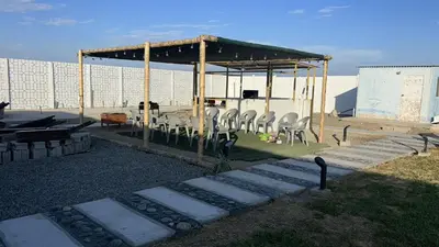 a gazebo with chairs and a table and a table and chairs at Descanso del Guerrero - PARACAS in Paracas