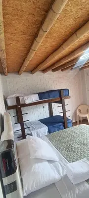 a bedroom with two bunk beds in a room at Descanso del Guerrero - PARACAS in Paracas