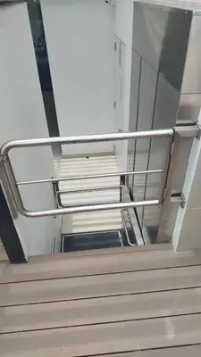 an empty stairs in a building with metal railing at Albano Penthouse íntimo piscina y vista al mar in Lima