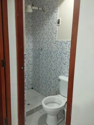 a bathroom with a white toilet in a room at Residencia PAZ Y BIEN in Cusco