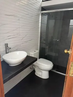 a bathroom with a white toilet and a sink at San Borja Room Baño Compartido in Lima