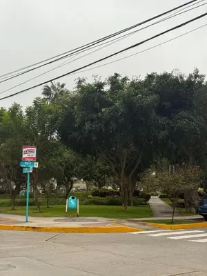 a street with a sign on the side of a road at San Borja Room Baño Compartido in Lima