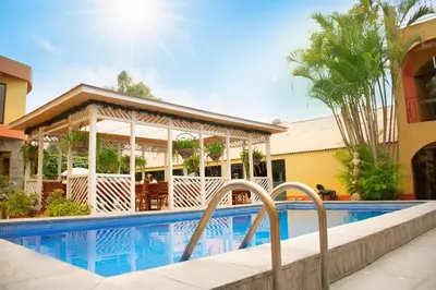 a pool at a resort with a gazebo at Hostal Sol Y Luna - Cieneguilla in Cieneguilla