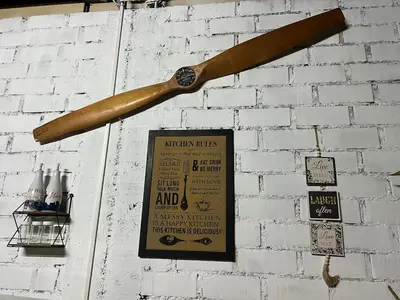 a wooden baseball bat hanging on a wall at Tres Gatos Paracas in Paracas