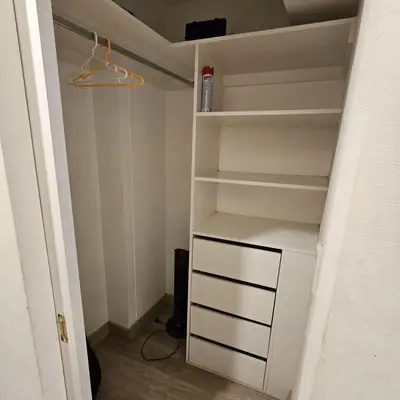 a closet with white shelves in a room at PERU STAY Barranco in Lima