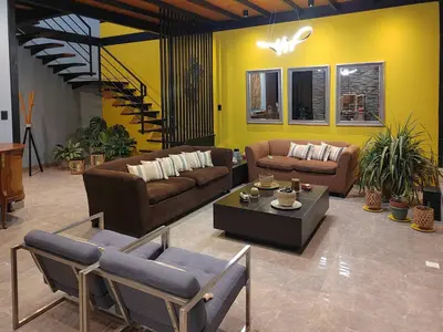 a living room with couches and a coffee table at Quiet 4BR Villa with Pool & Terrace in Ica